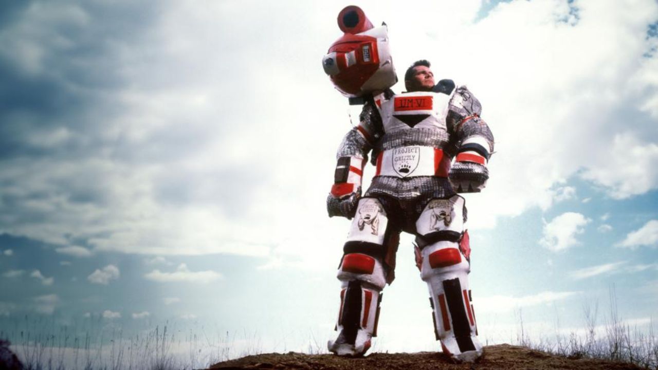 a man in a padded "grizzly suit"